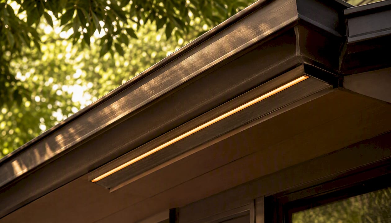 Roofline Lighting That Blends Invisible by Day Close-up of color-matched LED lighting channel on roof soffit